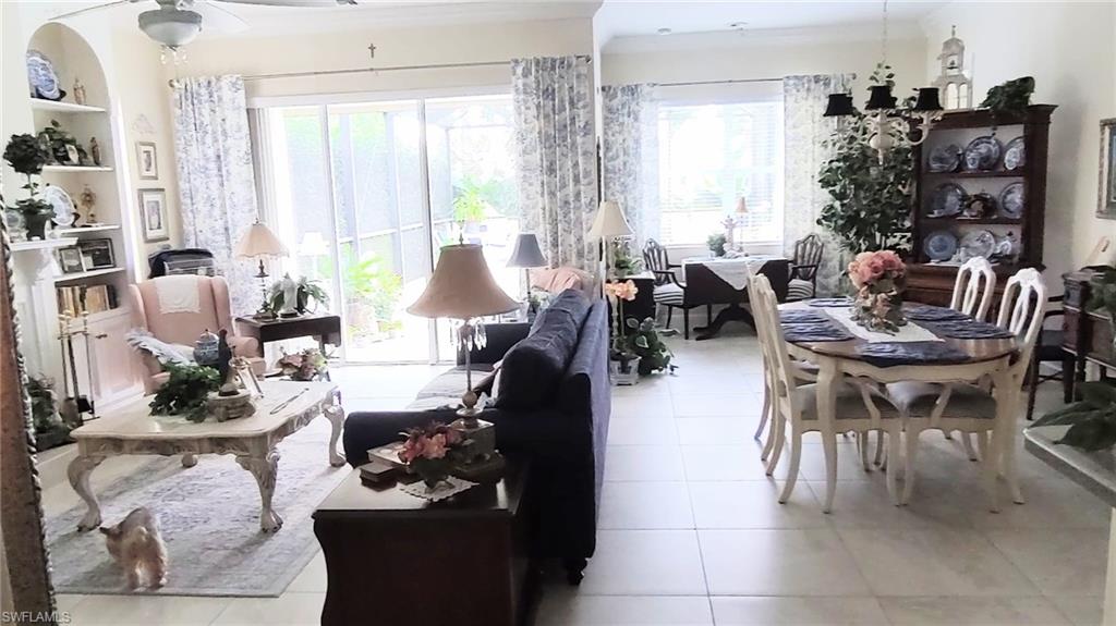 5220 Milano Street Ave Maria, FL 34142 - Photo 3 of 27 Sunroom featuring a chandelier and plenty of natural light