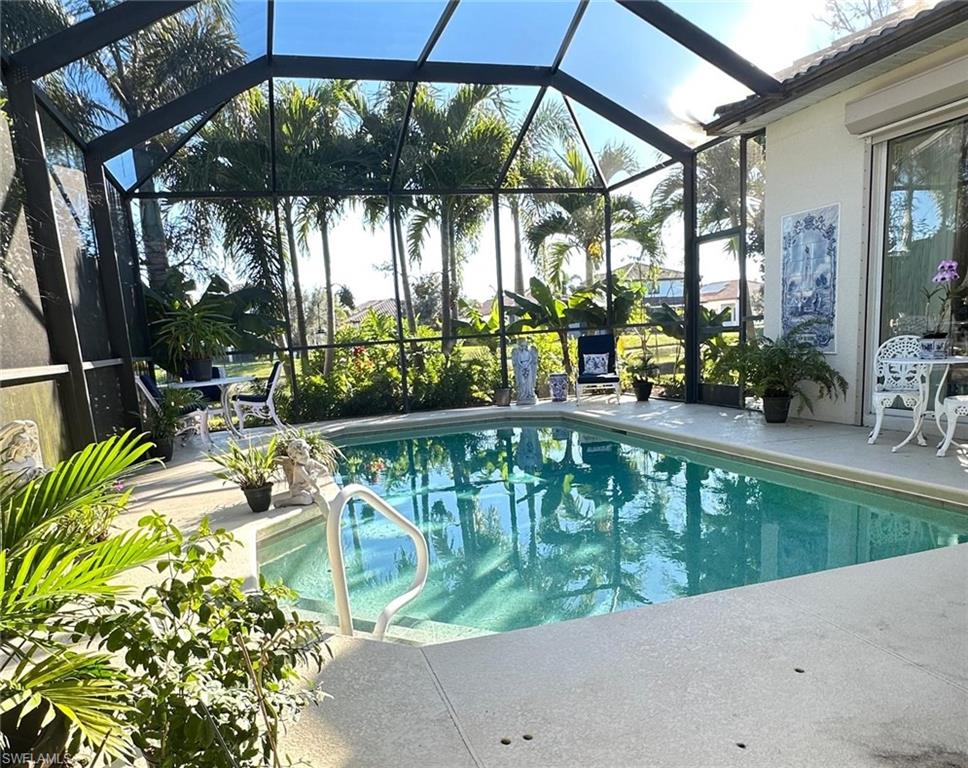 5220 Milano Street Ave Maria, FL 34142 - Photo 8 of 27 Swimming pool featuring a patio area, glass enclosure, and a sunroom