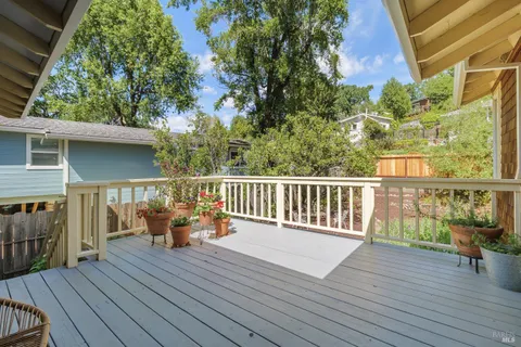 a balcony with wooden floor