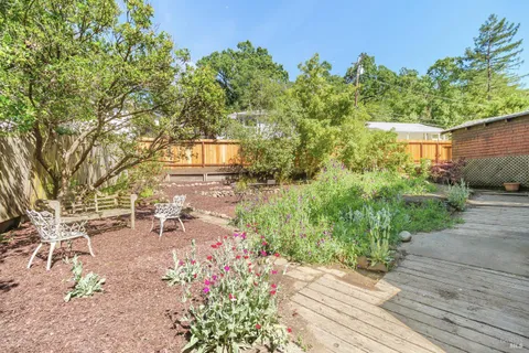a view of a backyard with sitting area