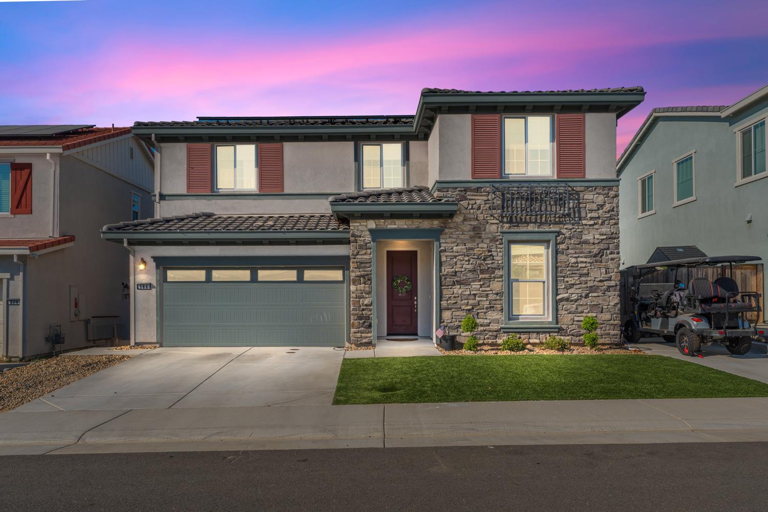 a front view of a house with a yard