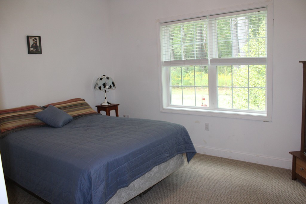 61 Turkey Hill Road Rutland, MA 01543 - Photo 22 of 30 a bedroom with a bed and a window