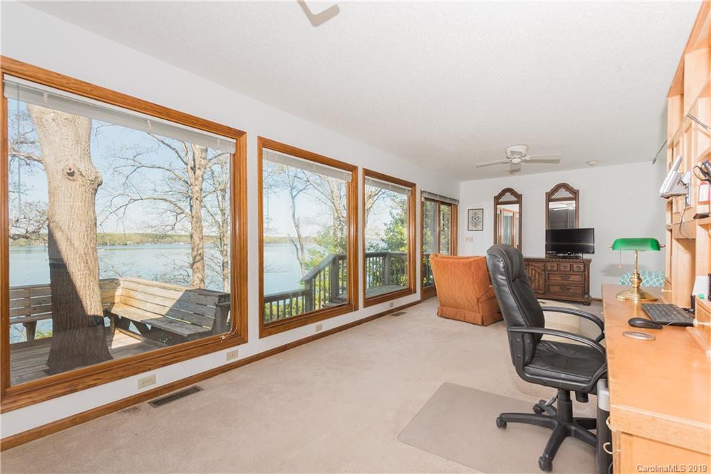29040 Snapper Point Tega Cay, SC 29708 - Photo 14 of 39 a living room with furniture and a floor to ceiling window