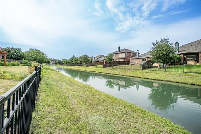a view of a lake with a garden