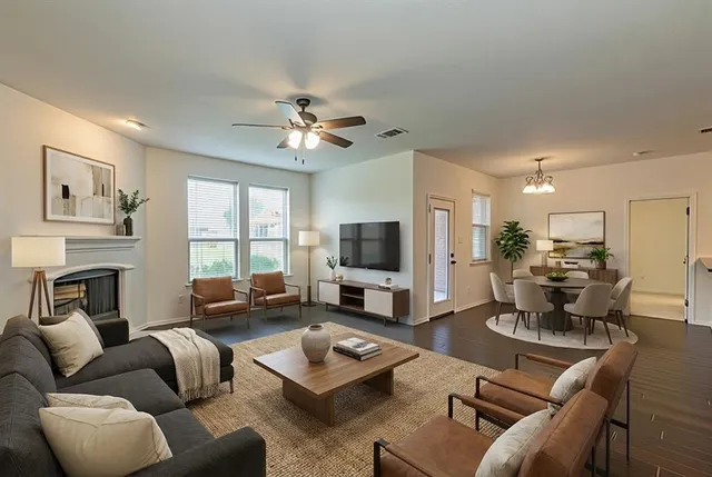 a living room with furniture fireplace and a flat screen tv