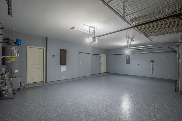 an empty room with fireplace and windows