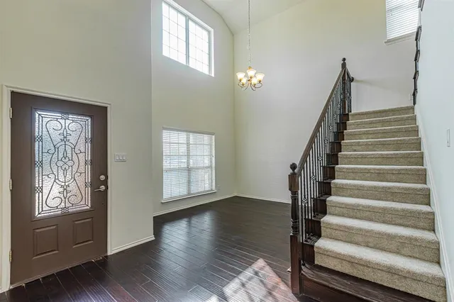 a view of an entryway with wooden floor
