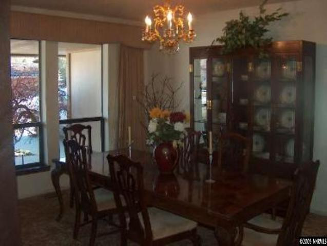 2771 East Lakeridge Reno, NV 89509 - Photo 3 of 8 a view of a dining room with furniture and chandelier