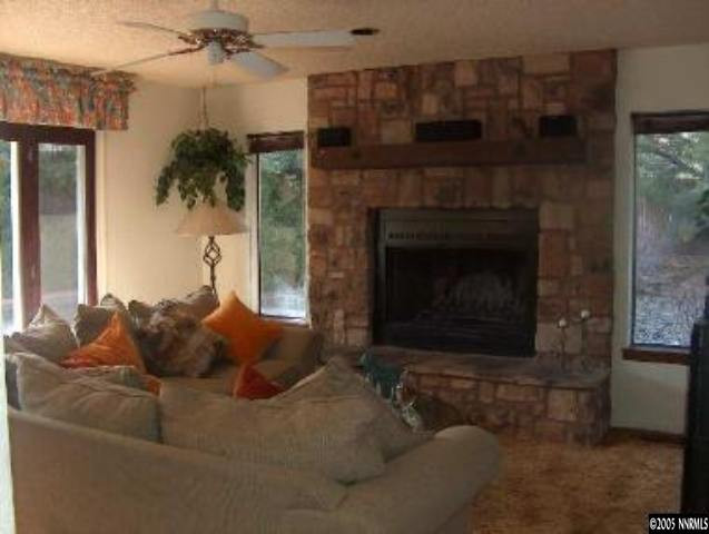 2771 East Lakeridge Reno, NV 89509 - Photo 7 of 8 a living room with furniture and a fireplace