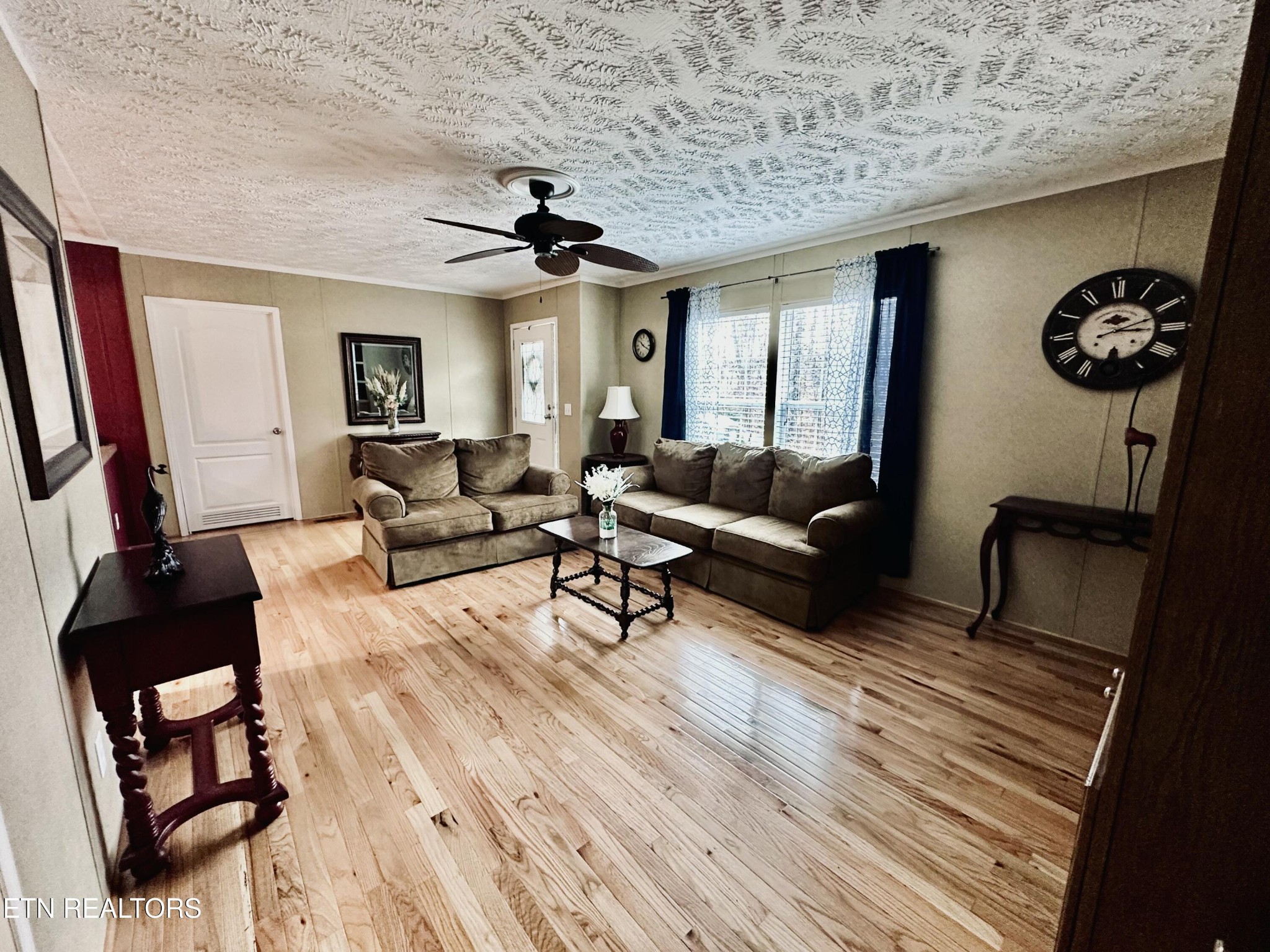 206 Randall Fugate Road Spring City, TN 37381 - Photo 7 of 28 a living room with furniture and wooden floor