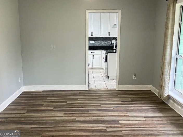 176 Whippoorwill Circle Kingsland, GA 31548 - Photo 13 of 18 a view of a kitchen with wooden floor and electronic appliances