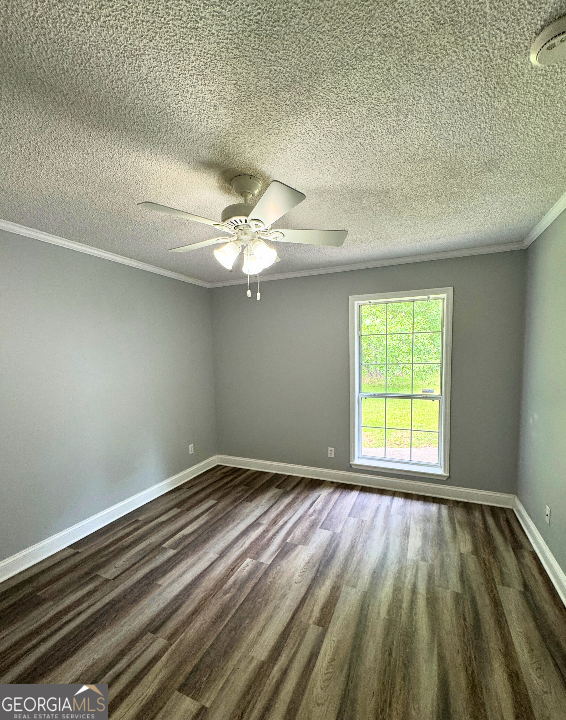 176 Whippoorwill Circle Kingsland, GA 31548 - Photo 16 of 18 en empty room with window