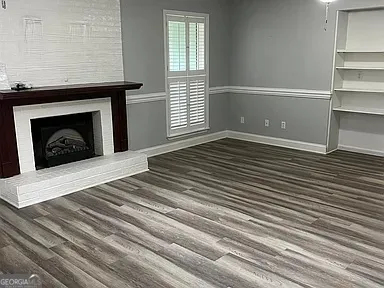 a bedroom with a bed and a fireplace