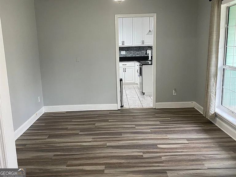 176 Whippoorwill Circle Kingsland, GA 31548 - Photo 4 of 18 a view of a room with wooden floor and staircase