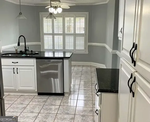 a kitchen with a sink and cabinets