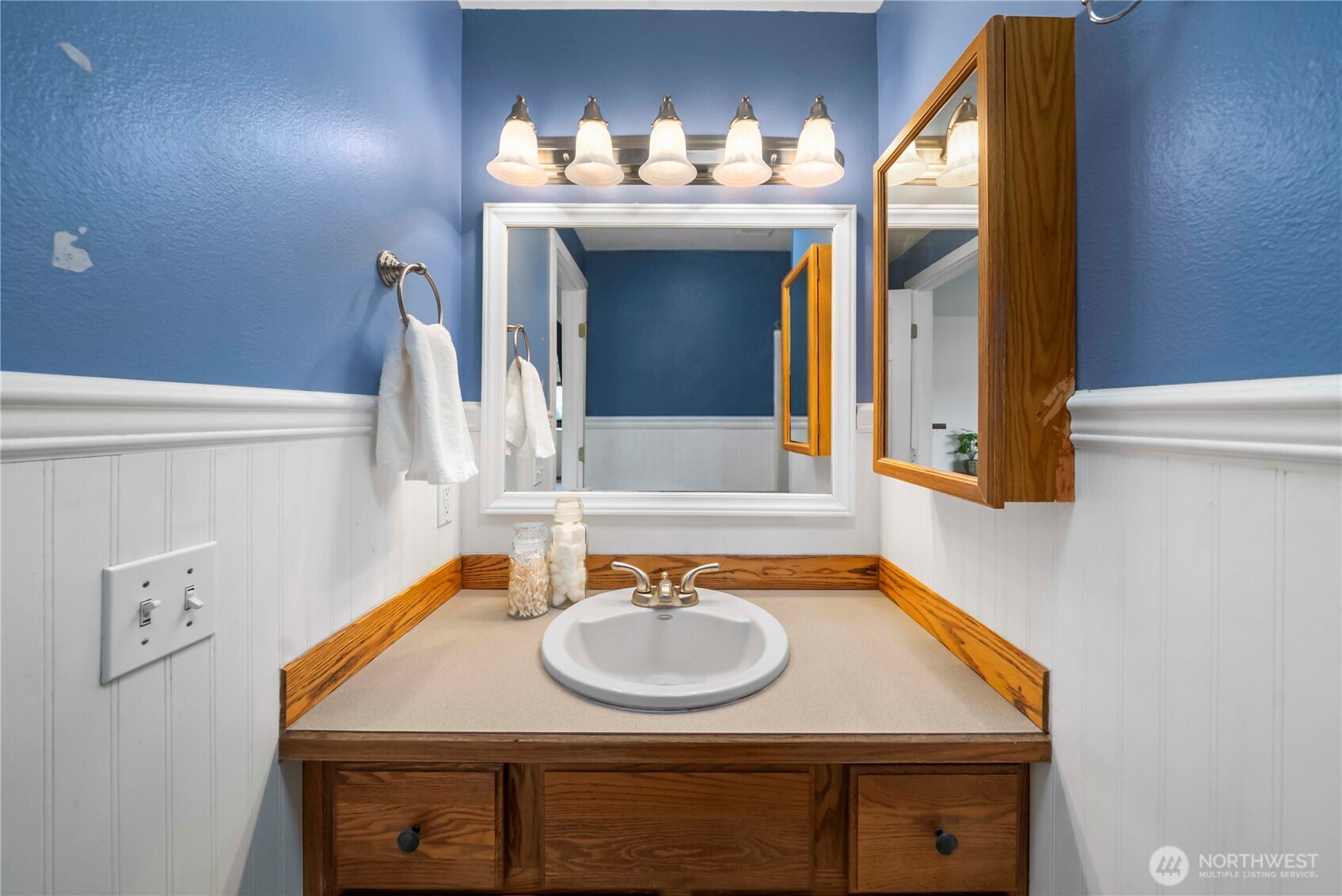 1010 Academy Street Sumner, WA 98390 - Photo 19 of 37 a bathroom with a sink and a mirror