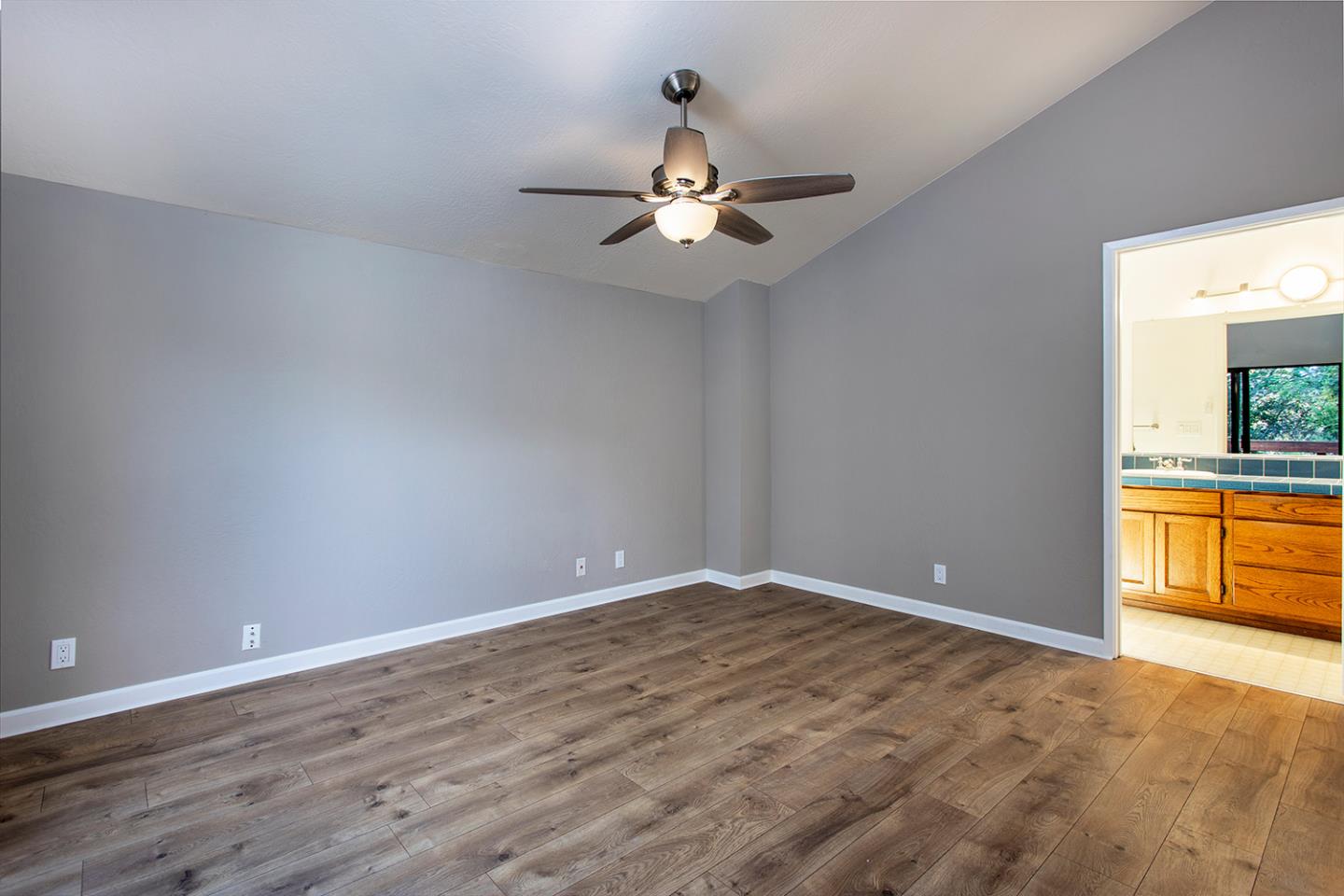 359 Moosehead Drive Aptos, CA 95003 - Photo 11 of 34 wooden floor in an empty room with a window