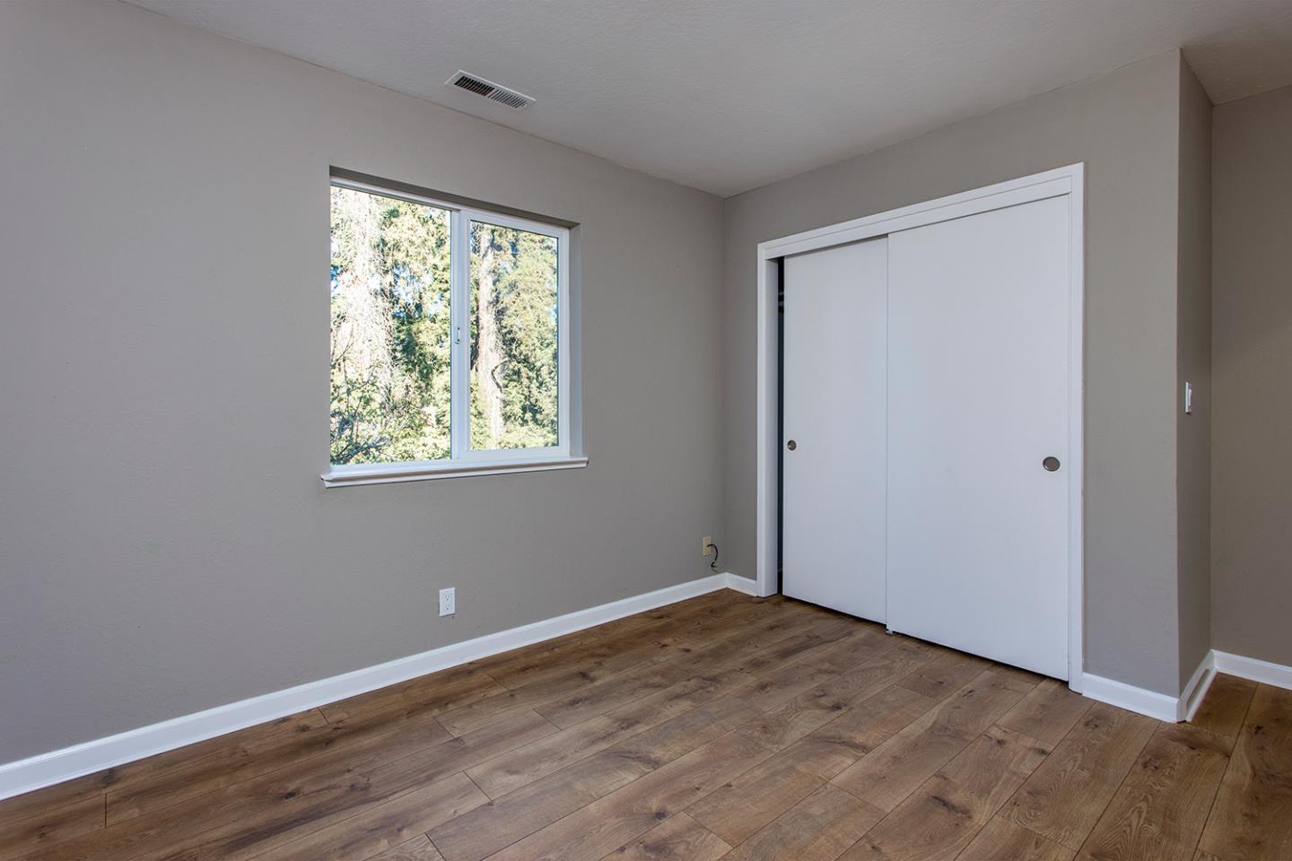 359 Moosehead Drive Aptos, CA 95003 - Photo 24 of 34 a view of an empty room with wooden floor and a window