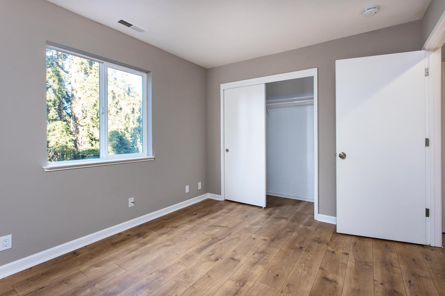 359 Moosehead Drive Aptos, CA 95003 - Photo 25 of 34 a view of an empty room with wooden floor and a window