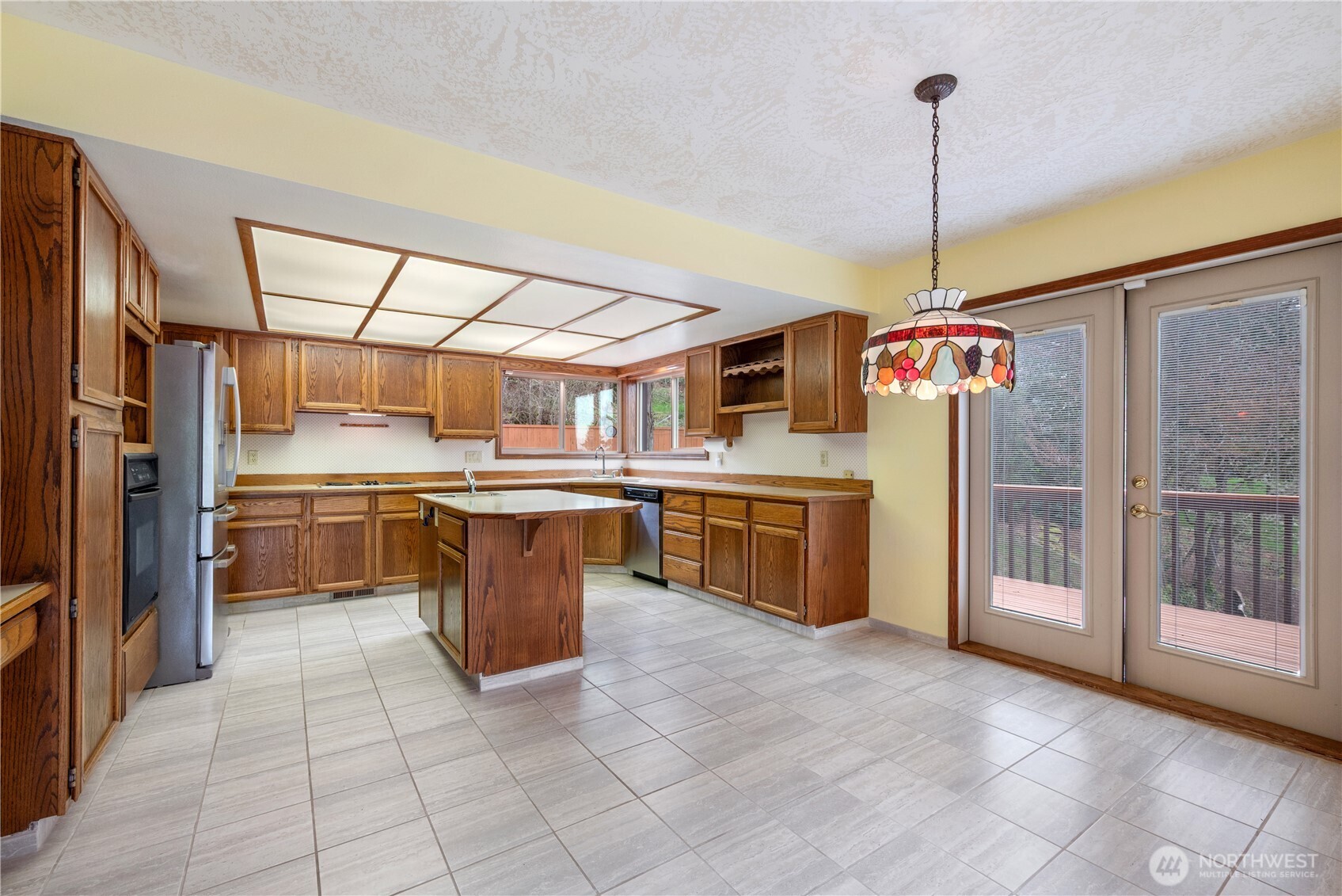 12 City View Boulevard Longview, WA 98632 - Photo 11 of 40 a kitchen with stainless steel appliances granite countertop a stove a sink dishwasher and a refrigerator
