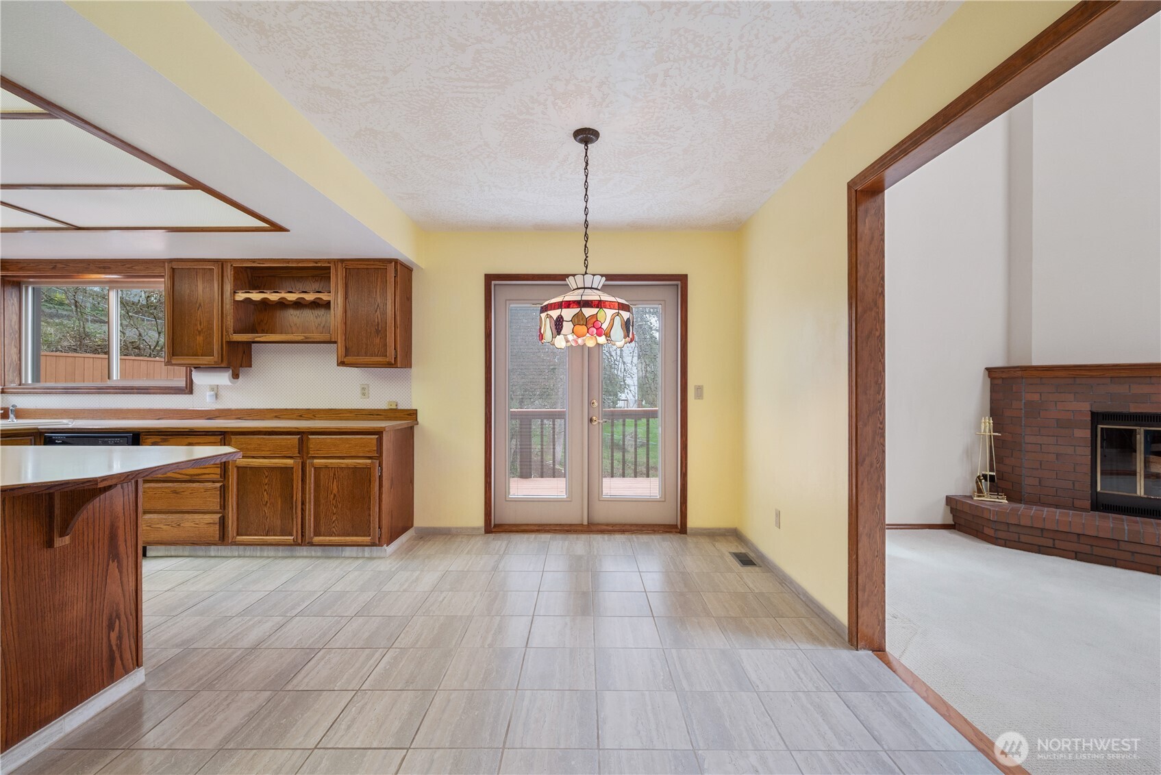 12 City View Boulevard Longview, WA 98632 - Photo 12 of 40 a view of a kitchen with a sink and a fireplace