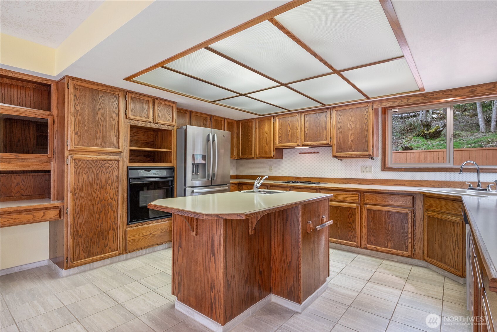 12 City View Boulevard Longview, WA 98632 - Photo 13 of 40 a kitchen with stainless steel appliances granite countertop a stove a sink and a refrigerator