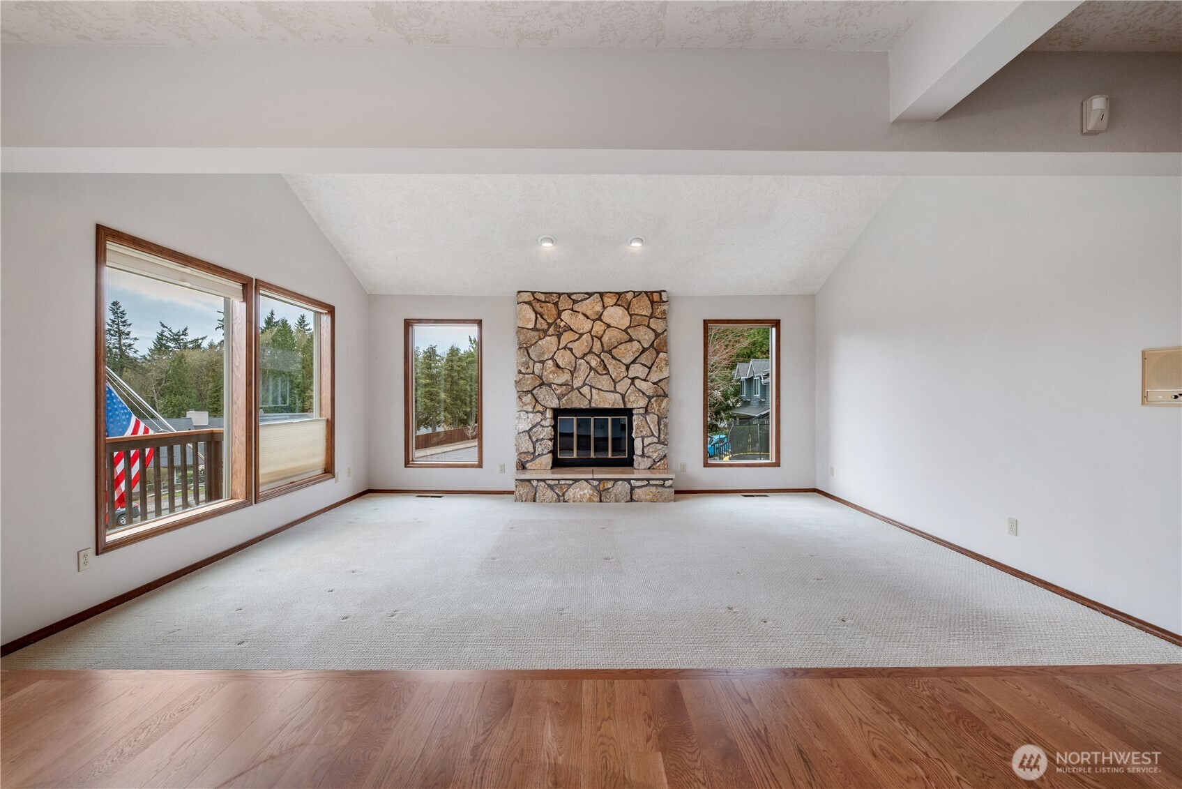 12 City View Boulevard Longview, WA 98632 - Photo 3 of 40 a view of an empty room with wooden floor and a window