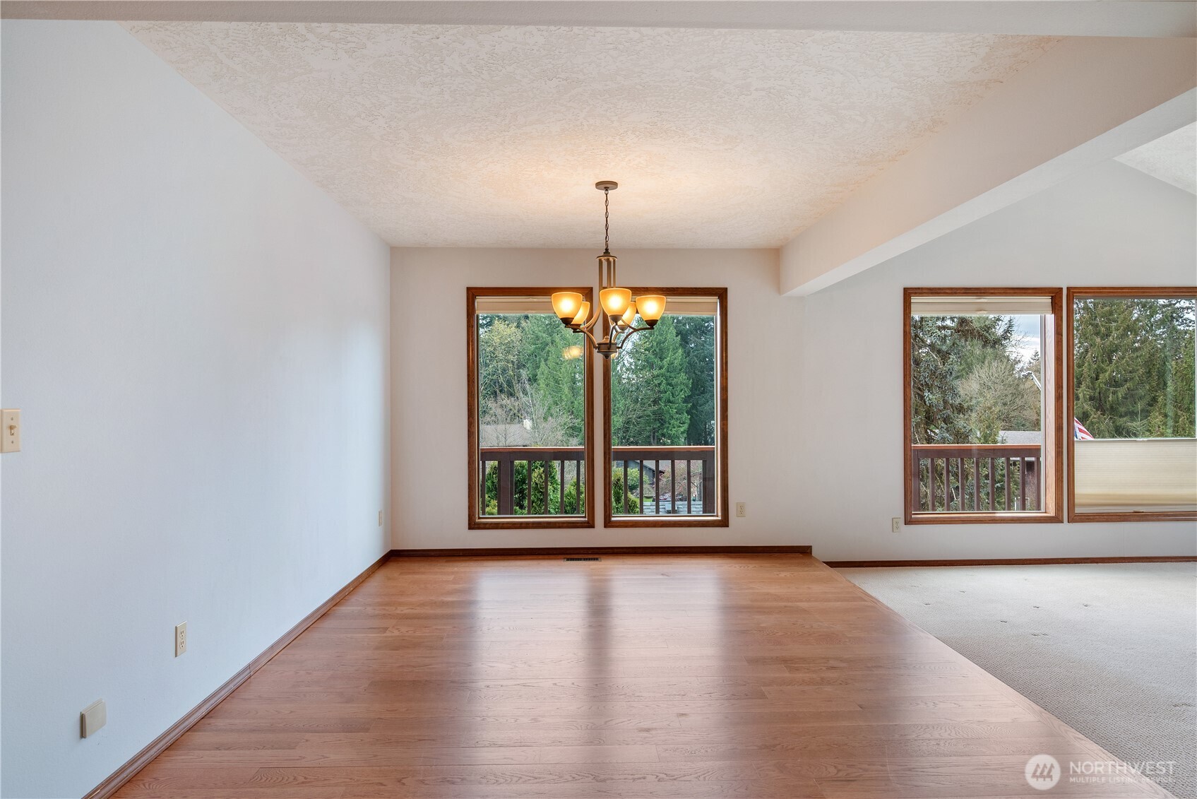 12 City View Boulevard Longview, WA 98632 - Photo 7 of 40 an empty room with wooden floor and windows