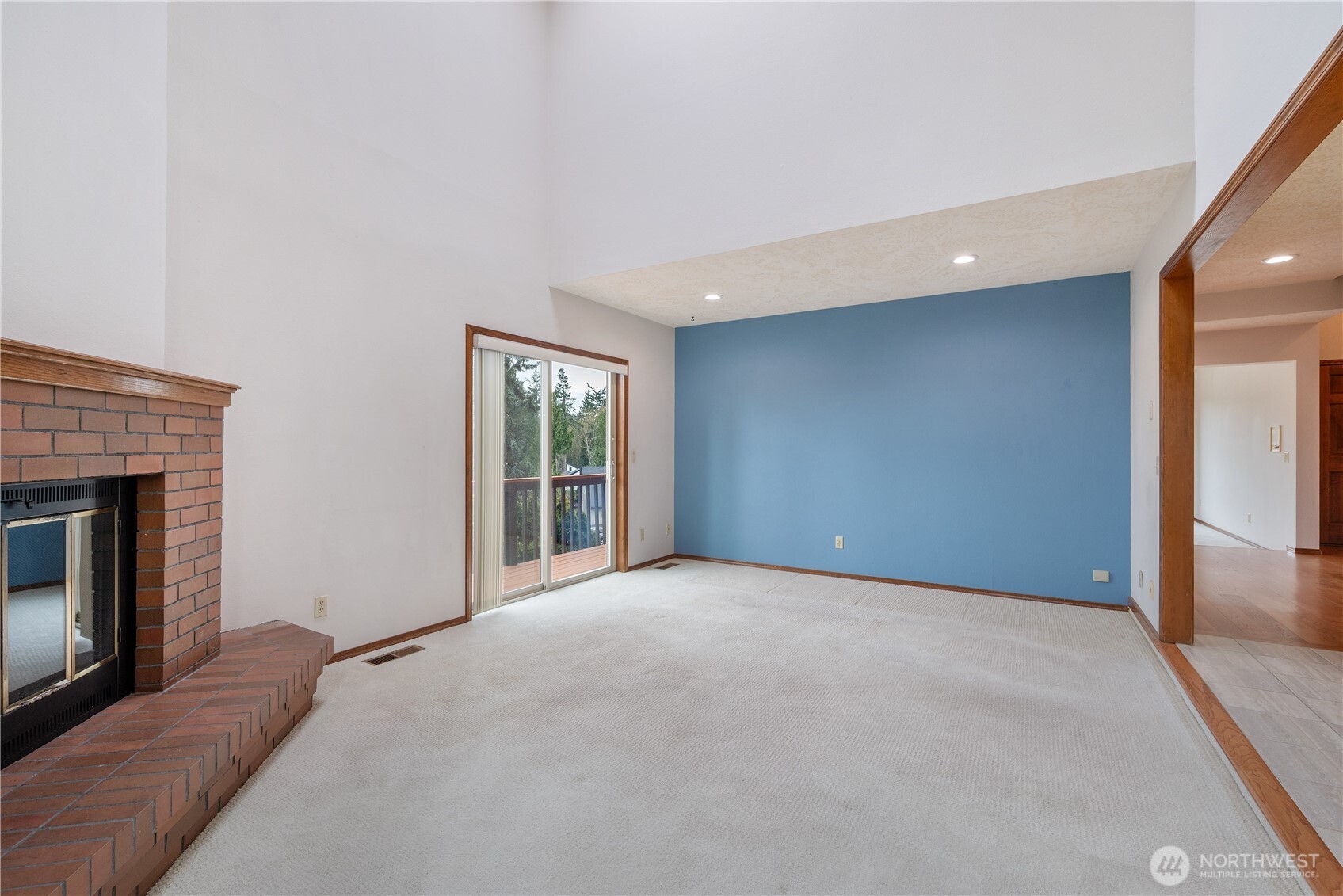 12 City View Boulevard Longview, WA 98632 - Photo 9 of 40 a view of an empty room with a fireplace and a window