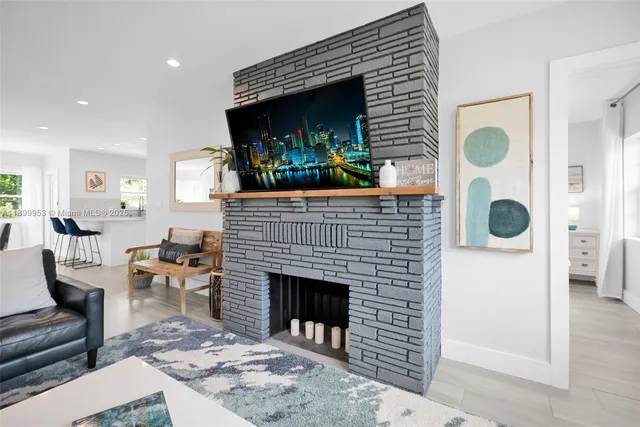 a kitchen with cabinets stainless steel appliances a sink and a window