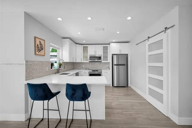 a living room with fireplace furniture and a flat screen tv