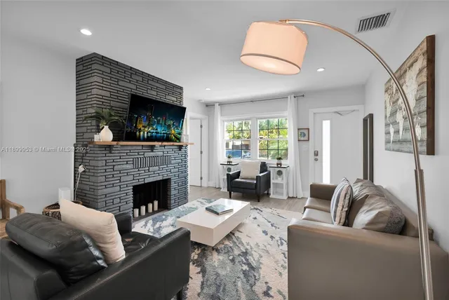a large kitchen with a table and chairs