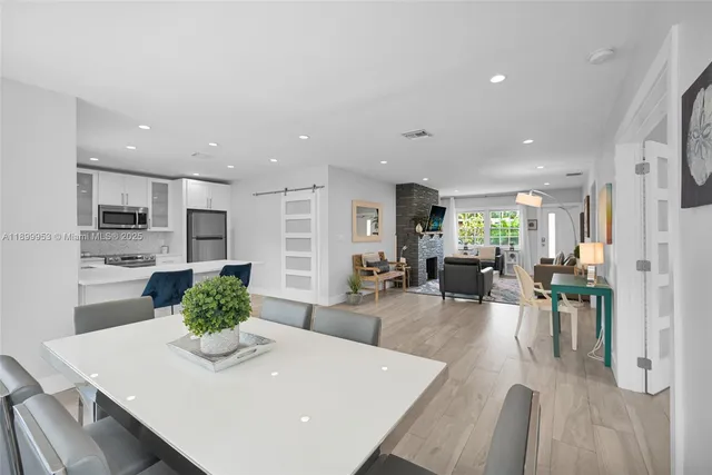 a living room with furniture and a lamp