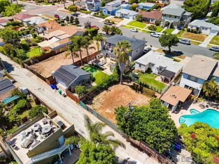 an aerial view of a residential houses with outdoor space