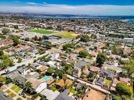 an aerial view of residential houses with outdoor space