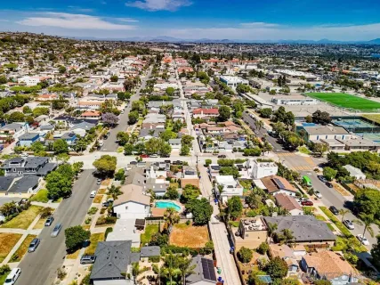 an aerial view of residential houses with outdoor space