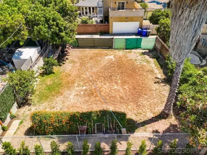 a view of yard with seating area and trees around