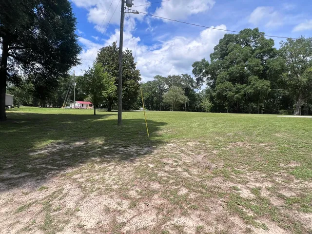 a view of outdoor space with trees all around