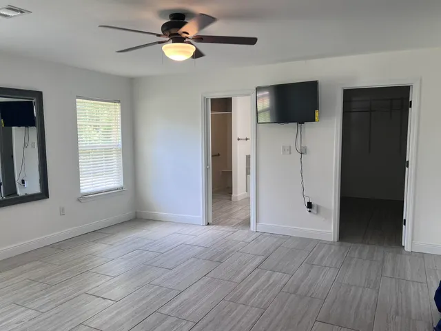 a view of livingroom with hardwood floor and ceiling fan