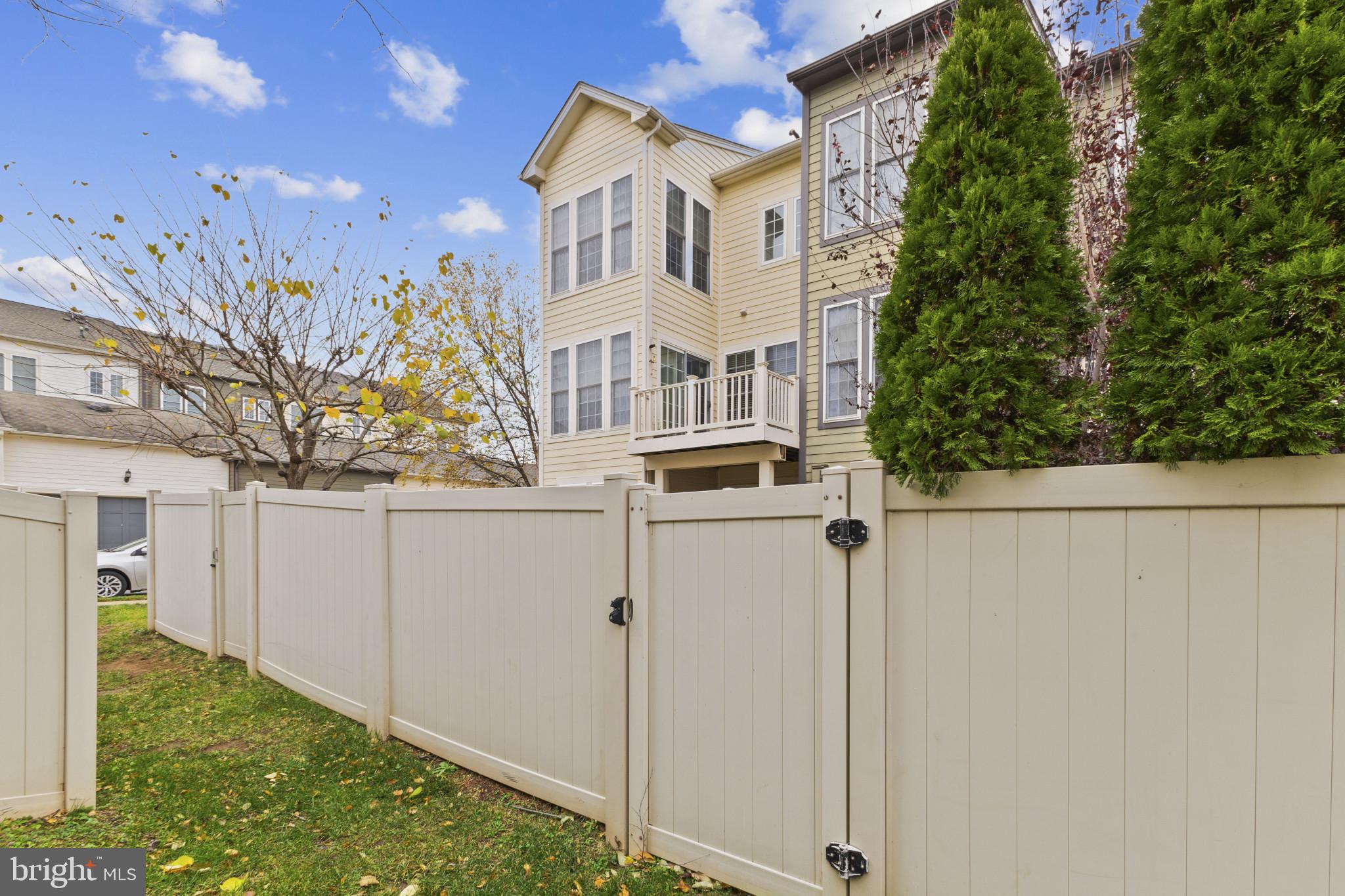 573 Dandelion Terrace Southeast Leesburg, VA 20175 - Photo 30 of 31 a view of a house with a yard