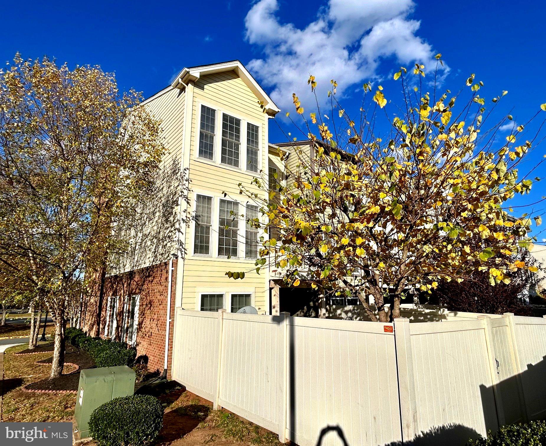 573 Dandelion Terrace Southeast Leesburg, VA 20175 - Photo 4 of 31 a front view of a house with a yard