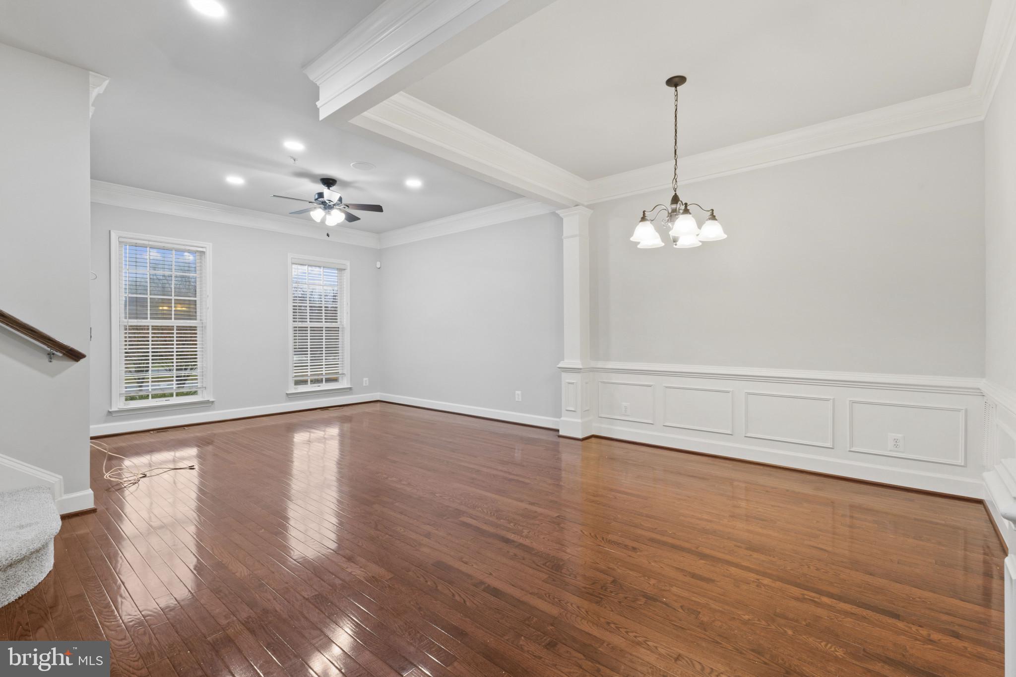 573 Dandelion Terrace Southeast Leesburg, VA 20175 - Photo 6 of 31 a view of an empty room with wooden floor and a window