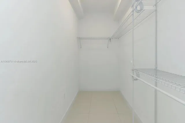 a view of storage and utility room with empty racks