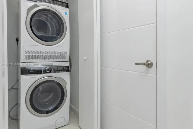 a close view of a utility room with dryer and washer