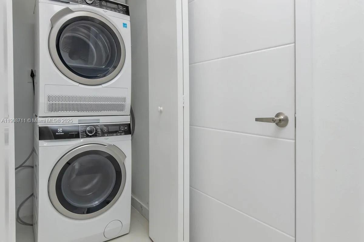 25850 Southwest 140th Court, Unit 6209 Homestead, FL 33032 - Photo 19 of 29 a close view of a utility room with dryer and washer