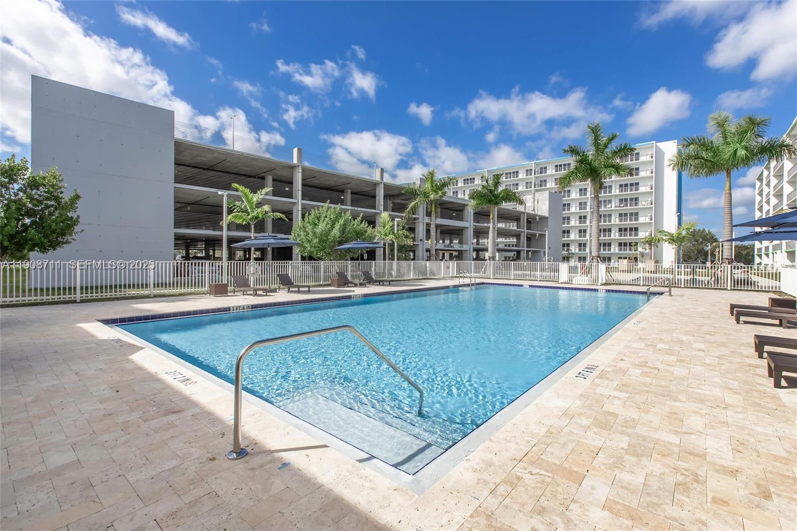 25850 Southwest 140th Court, Unit 6209 Homestead, FL 33032 - Photo 25 of 29 a view of a swimming pool with a patio