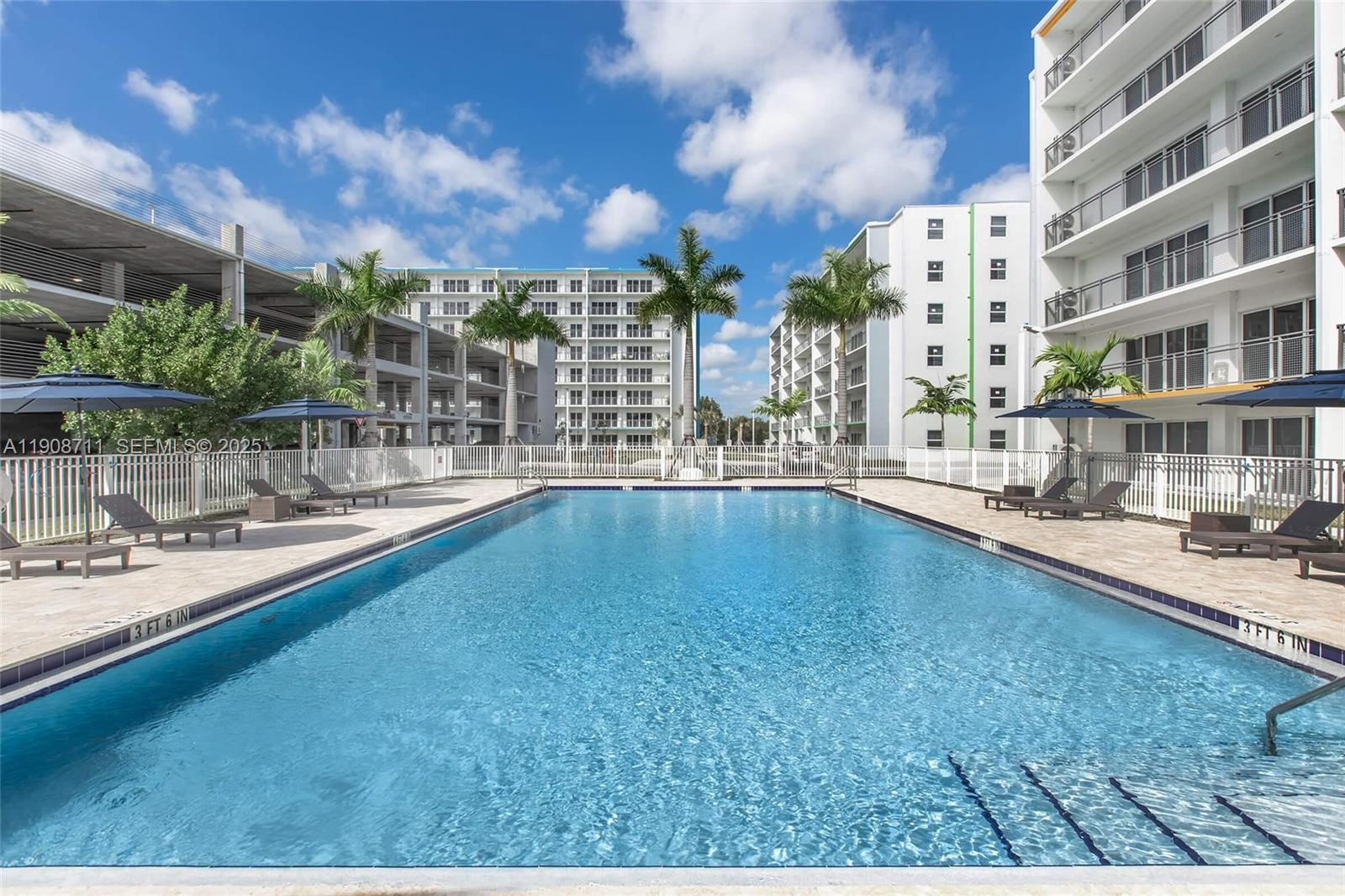 25850 Southwest 140th Court, Unit 6209 Homestead, FL 33032 - Photo 27 of 29 a view of swimming pool with outdoor seating