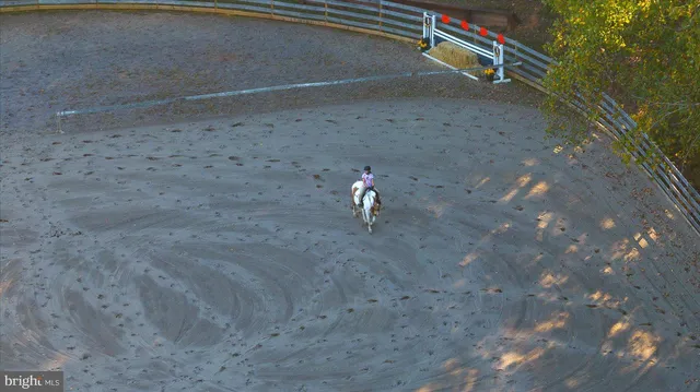 a view of a swimming pool with an outdoor space and seating area