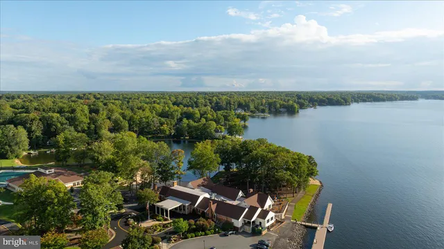 a view of a lake with a house in the background