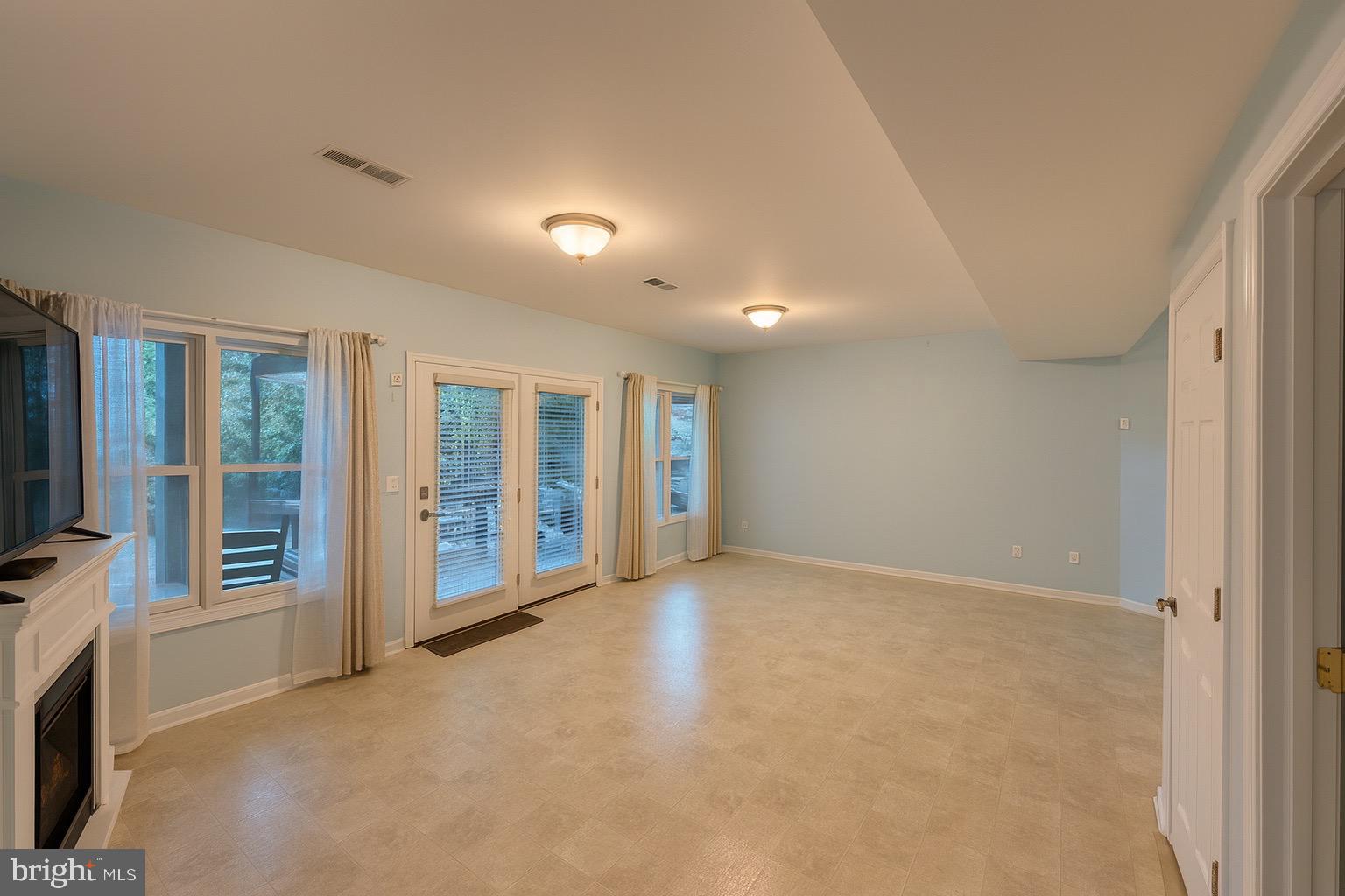 305 Wakefield Drive Locust Grove, VA 22508 - Photo 5 of 54 a view of an empty room with a fireplace and a window